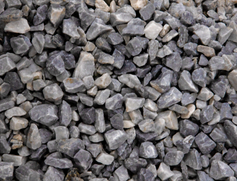 Ice blue chippings, containing angular, blue & light grey marble, graded from 10mm to 20mm, displayed loose.