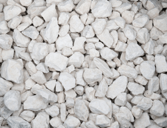 Buff-coloured clean limestone chippings displayed loose, containing grades from 10mm to 20mm.