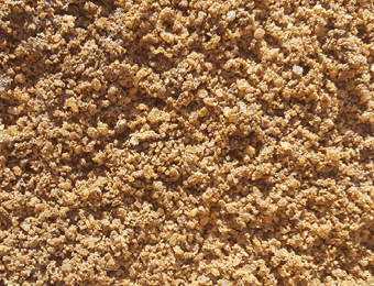 De-icing salt, brown in colour, displayed loose.
