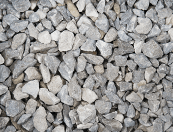 Battleship grey limestone chippings graded from 10mm to 20mm, displayed loose.
