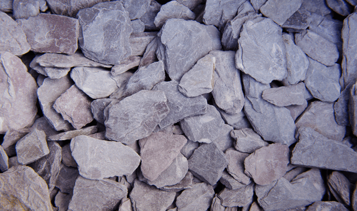 Plum slate, containing plum, blue & grey coloured slate, graded from 30mm to 50mm, displayed dry.